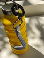 The que Collapsible Water Bottle with Key Chain