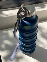 The que Collapsible Water Bottle with Key Chain